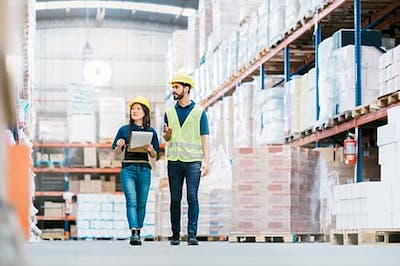 workers walking through warehouse