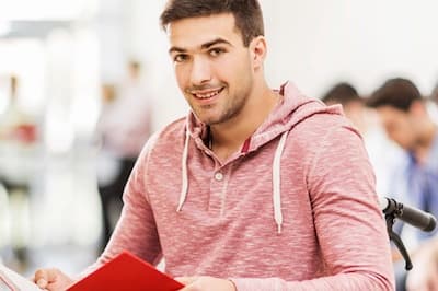 Student with book in wheelchair