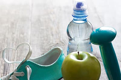 tennis shoe, water, apple and hand-weight