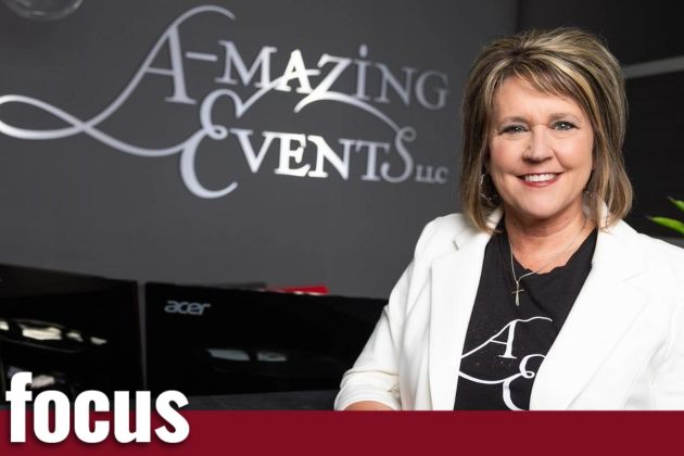 Woman smiling with red banner across bottom of photo with the word 