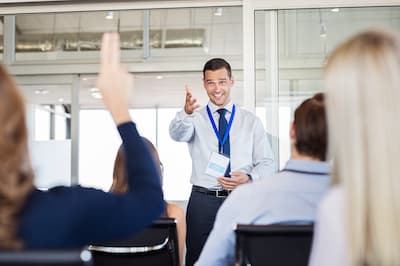 trainer calling on trainee in class