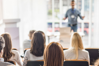 trainer standing in front of training class