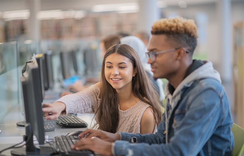 Two students working at a computer