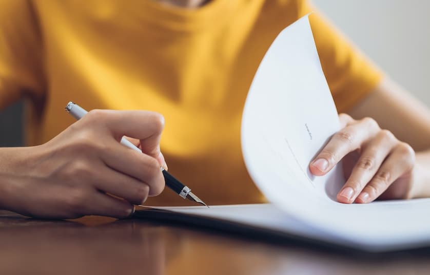 Person signing paperwork