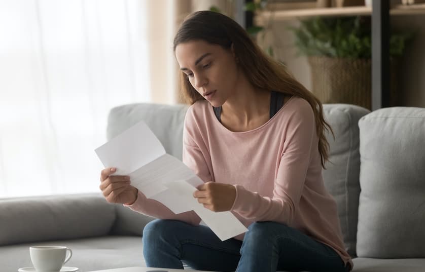 Female looking at a letter