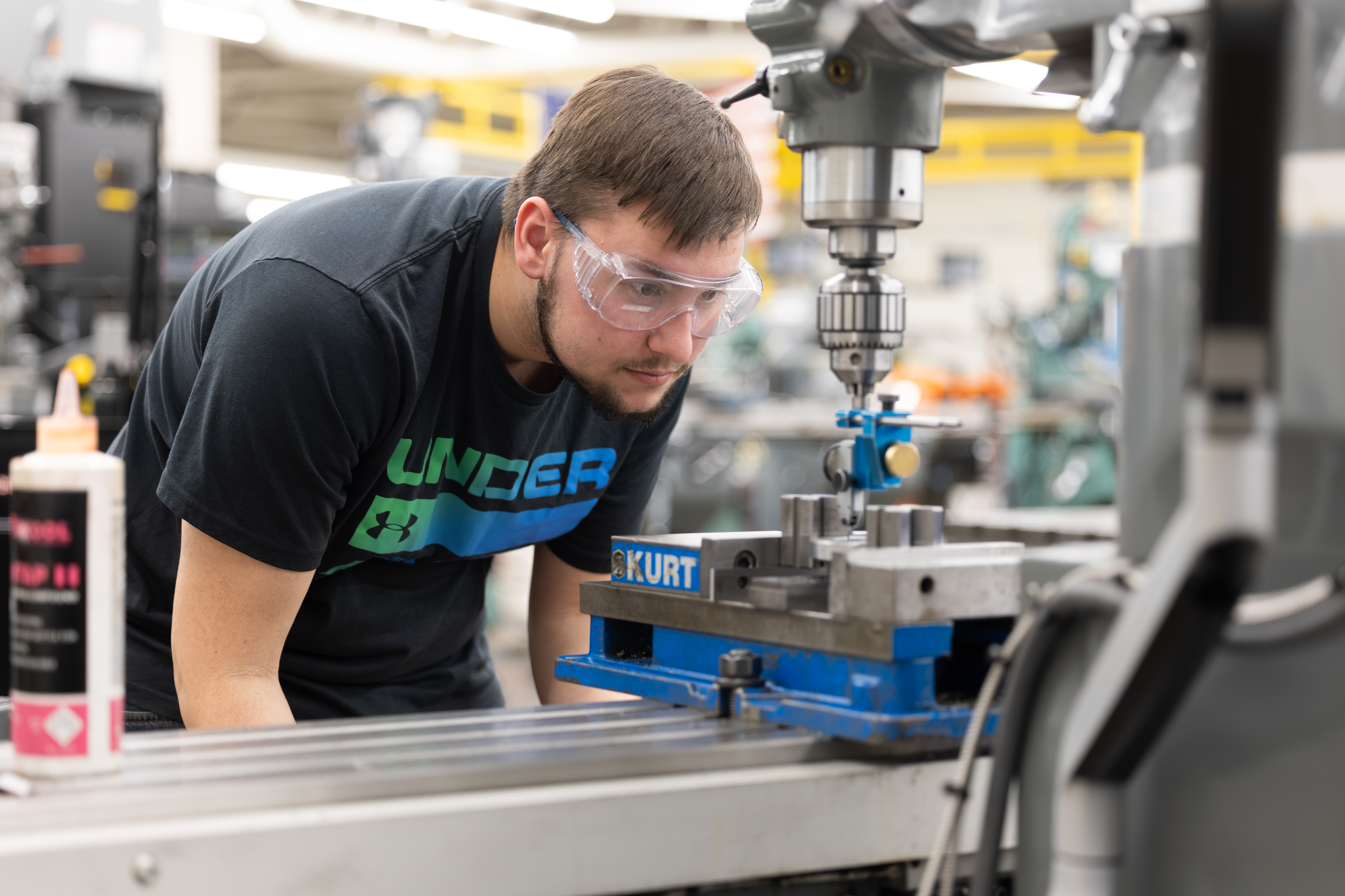 Student using machining equipment