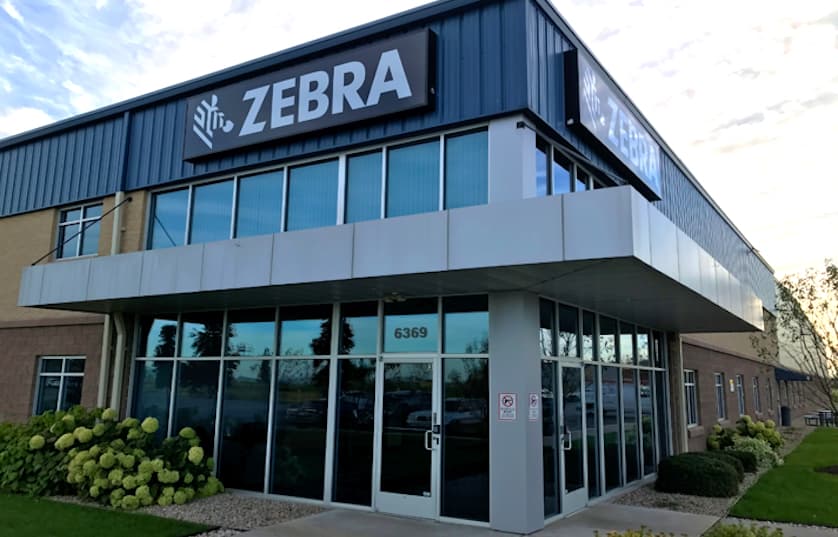 building with Zebra company sign
