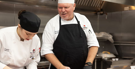 fox valley tech culinary instructor teaching a student