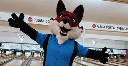 Sly the fox mascot bowling