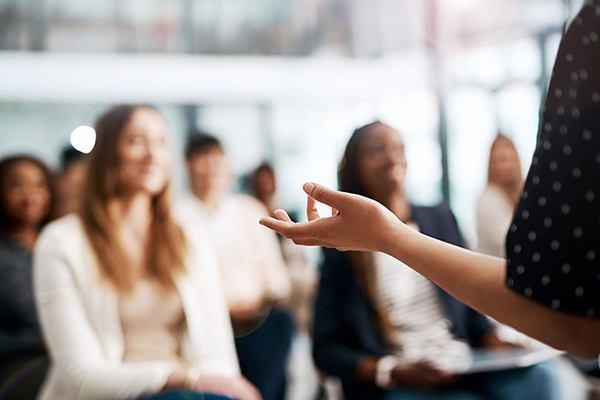 presenter talking to a group of people