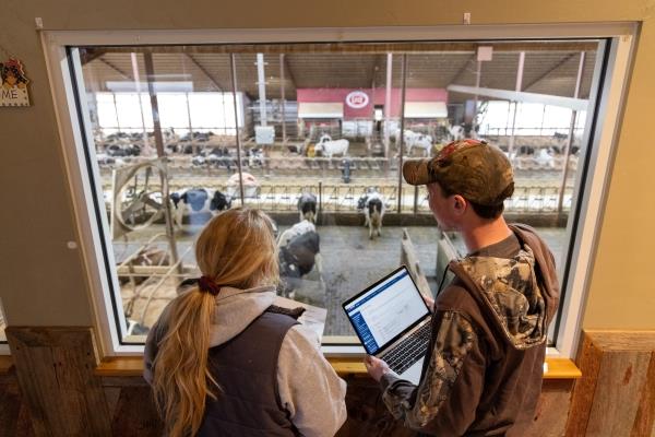 students overseeing a dairy farm