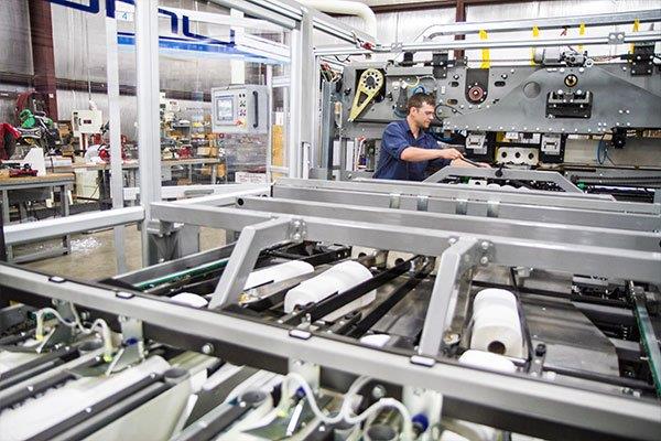 man working in shop on machine