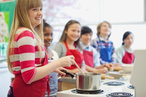 students cooking in a consumer ed class