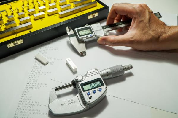 person using a variety of metrology tools