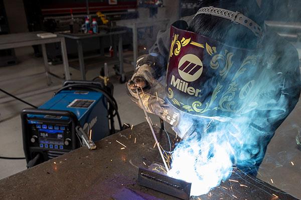 student working on a welding project