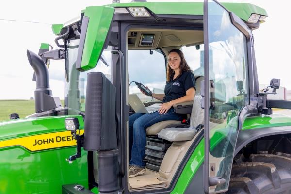 student in a precision ag john deere tractor