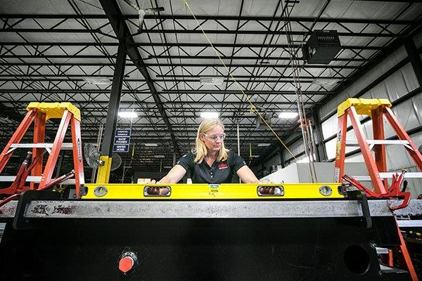 woman evaluating a quality issue in manufacturing