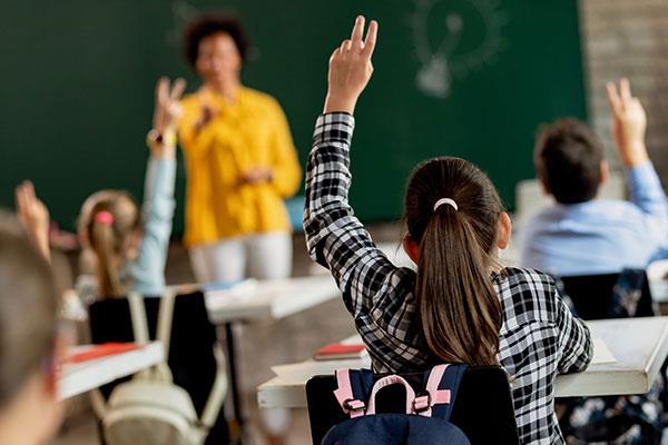 elementary classroom with teacher at the front