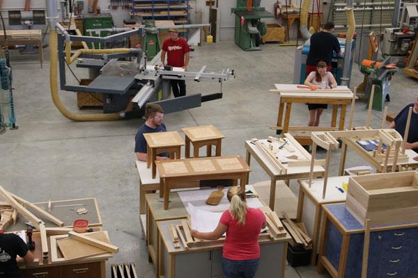 students working in wood manufacturing lab