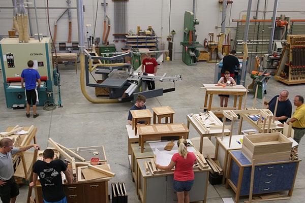 students working in a woodworking lab