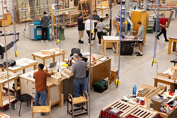 students working in a woodworking lab