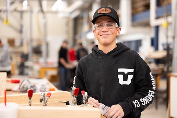 students working in wood manufacturing lab