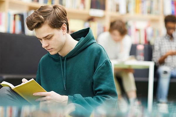 student in library studying