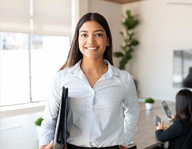 smiling communications expert in office setting