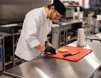 hospitality student setting a table