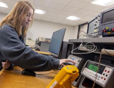 student working on an electronics project