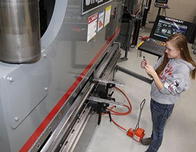 person working on a machine