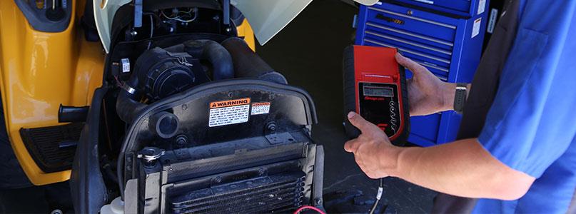 person working on a diagnostic machine